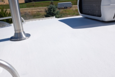 Applying Dicor Cool Coat to the roof of our travel trailer