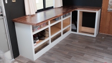 wooden strip desktop installed on cabinet base