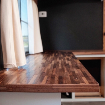 wooden strip desktop installed on cabinet base