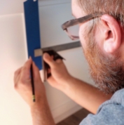 installing hardware in cabinets for travel trailer turned tiny house remodel